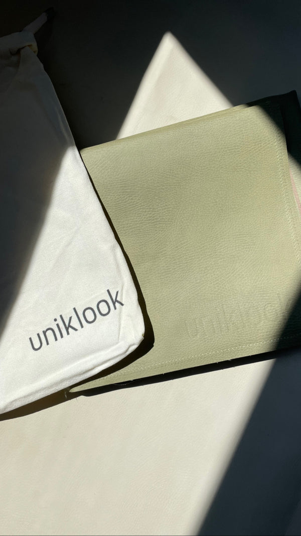 Uniklook vegan leather hunter green med showing the canva bag that it comes in.