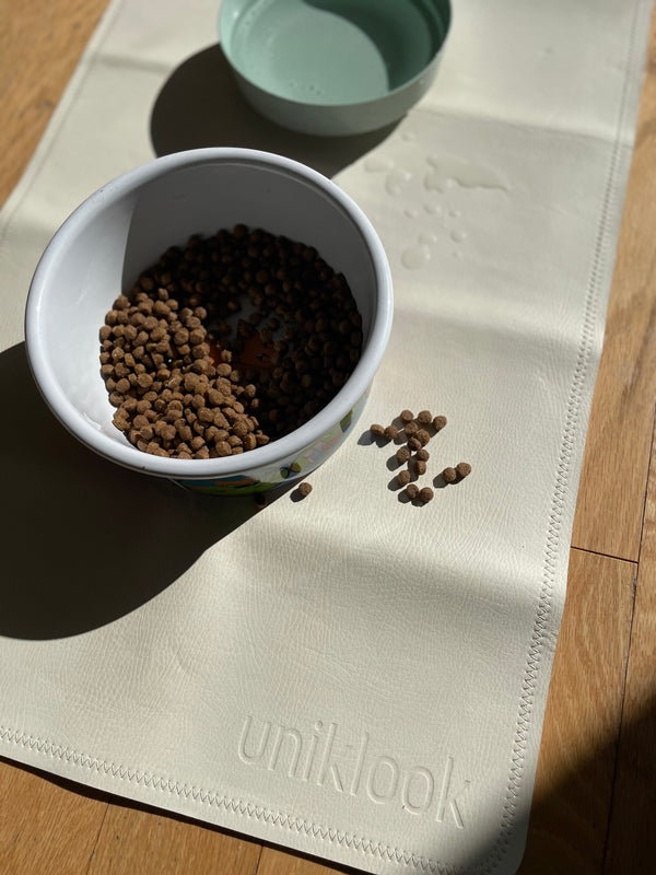 cream vegan leather pet food mat with food bowl and water bol