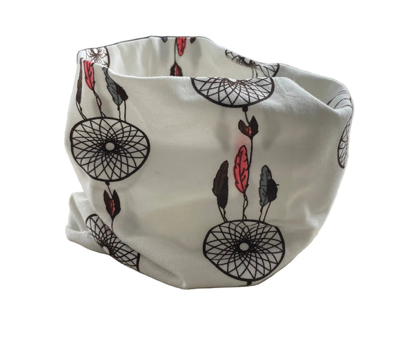 White shower cap with black and red designs on a white surface