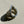 Load image into Gallery viewer, Silver ring with intricate designs on a light beige textured surface
