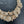 Charger l'image dans la galerie, Gold bracelet with intricate design on a dark background
