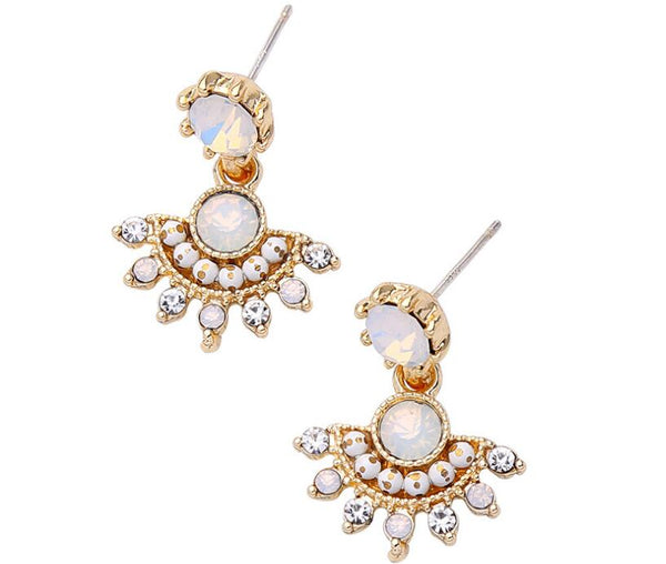 Gold and white earrings with opal-like stones on a white background