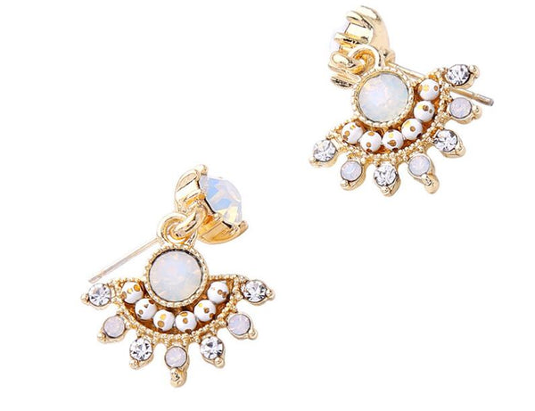 Gold earrings with opal stones on a white background