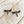 Charger l'image dans la galerie, Silver dragonfly earrings on a wooden surface
