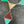 Load image into Gallery viewer, Geometric necklace with triangular pendants on a dark surface
