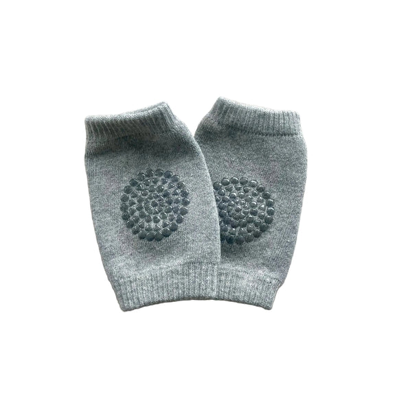 Pair of gray baby leggings with textured design on a light gray background