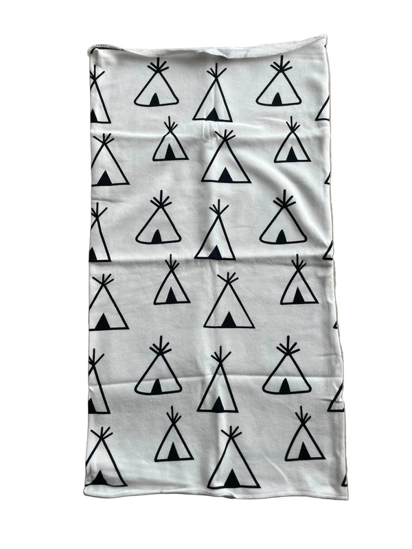 White pillowcase with black geometric pattern on a beige surface