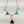 Load image into Gallery viewer, Geometric necklace with triangles on a dark surface
