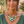 Charger l'image dans la galerie, Woman wearing a green and silver necklace outdoors with plants in the background
