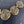 Charger l'image dans la galerie, Bronze spiral necklace on a dark textured background

