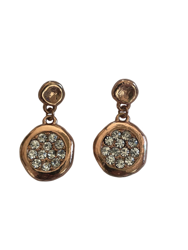 Pair of rose gold earrings with gemstones on a light gray background