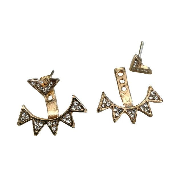 Pair of gold and diamond-studded earrings on a light gray background