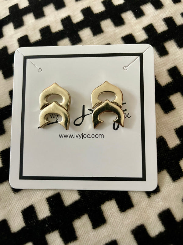 Gold earrings on a card with 'ivvijoe' branding against a black and white patterned background
