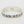 Load image into Gallery viewer, Silver bangle with floral patterns on a white background
