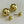 Charger l'image dans la galerie, Gold spherical earrings on a light gray background
