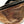Charger l'image dans la galerie, Brown leather fanny pack with a black zipper on a white background
