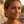 Load image into Gallery viewer, Woman with styled hair and earrings against a blurred outdoor background
