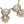 Load image into Gallery viewer, Decorative necklace with pink stones and gold accents on a dark surface
