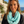 Load image into Gallery viewer, Woman wearing a turquoise patterned scarf with a scenic background
