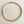 Charger l'image dans la galerie, A gold-toned snake chain necklace arranged in a circle on a light beige wood-grain surface.
