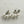 Charger l'image dans la galerie, Pair of pearl earrings on a textured white surface
