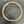 Charger l'image dans la galerie, A gold-toned metal link chain necklace or choker laid flat on a dark gray textured surface.
