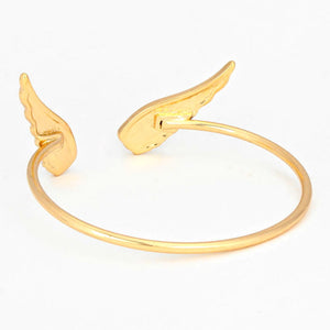 Gold bracelet with angel wing design on a white background