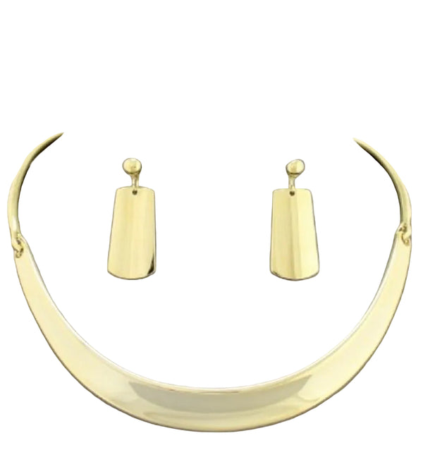 Gold necklace and earrings on a gray mannequin neck