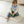 Load image into Gallery viewer, Child playing with colorful stacking toys on a white mat in a room.
