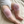 Charger l'image dans la galerie, Baby wearing pink knitted knee pads on a beige surface
