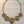Charger l'image dans la galerie, Gold spiral necklace on a dark marble surface
