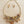 Load image into Gallery viewer, A gold-tone statement necklace with matching drop earrings, featuring multiple layered chains, faceted beads, and dangling crystal-like charms in amber, brown, and gold tones, displayed on a light wood surface.
