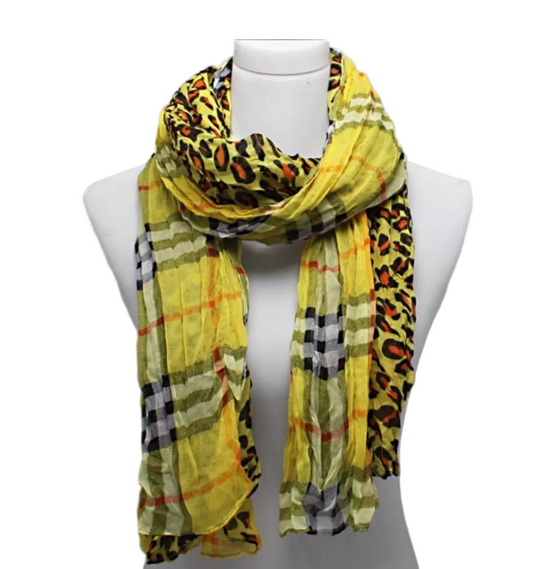 Scarf with checkered and leopard print patterns on a mannequin against a gray background