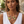 Charger l'image dans la galerie, A woman wearing a chunky statement necklace with large oval orange and yellow cabochons set in silver, paired with matching drop earrings and a white sleeveless top.
