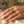 Load image into Gallery viewer, Hand wearing a silver ring on a rocky surface with a natural background
