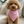 Charger l'image dans la galerie, Small brown dog wearing a pink bandana sitting on a beige couch.
