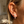 Load image into Gallery viewer, Close-up of an ear wearing a pearl earring with a blurred indoor background
