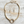 Charger l'image dans la galerie, Gold necklace and earrings set on a wooden surface
