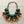 Charger l'image dans la galerie, Colorful beaded necklace with green, orange, and red beads on a white background
