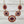 Load image into Gallery viewer, Ornate earrings with red and gold design on a white background
