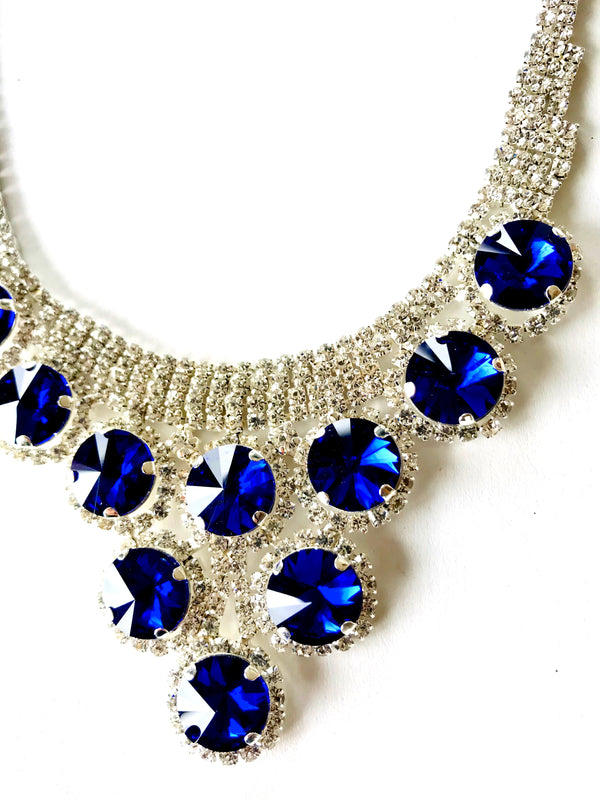 Necklace with blue gemstones on a white background