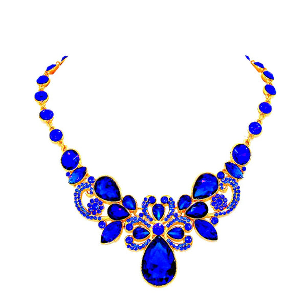 Jewelry set with blue teardrop-shaped stones and gold accents on a white background
