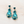 Load image into Gallery viewer, Pair of turquoise teardrop earrings on a light background

