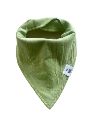 Green baby bib on a light gray surface