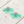Charger l'image dans la galerie, Turquoise tassel earrings with pink and gold center on a wooden surface
