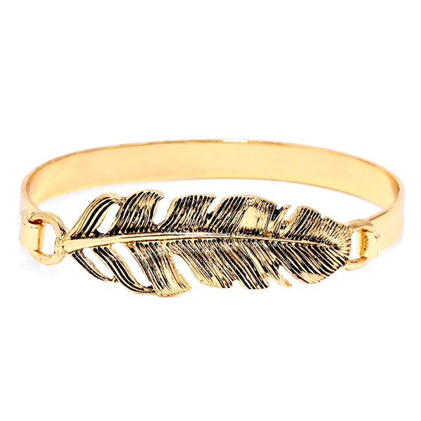 Gold bracelet with feather design on a white background