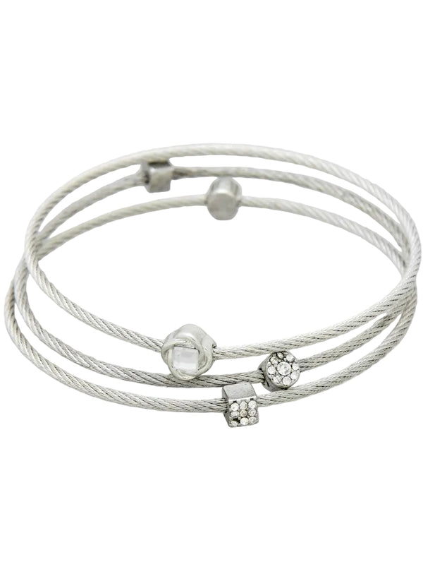 Silver bracelet with multiple braided strands and decorative beads on a light gray background