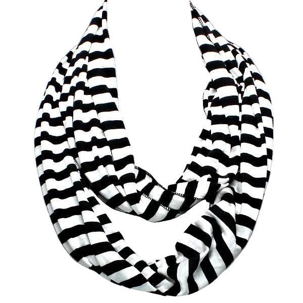 Black and white striped scarf on a mannequin against a gray background