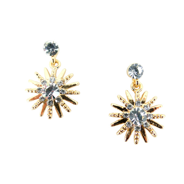 Gold sunburst earrings with clear gemstones on a light gray background