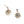 Charger l'image dans la galerie, Gold sunburst earrings with a central gemstone on a light gray background
